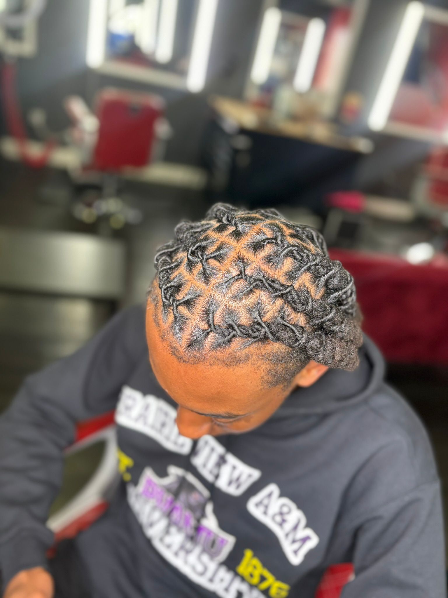Long two-strand twists styled by Luxury Locs by Ive